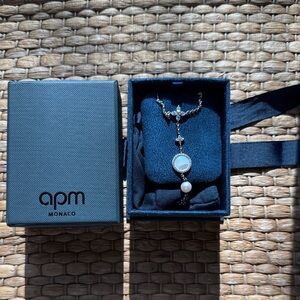 Elegant Silver Necklace with Pearl Accents. APM MONACO.